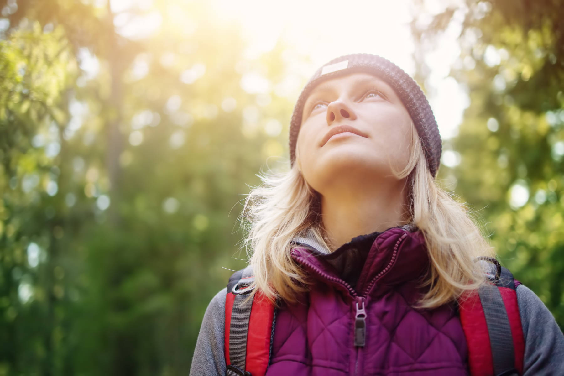 woman with good skin outdoors reflecting on climate change